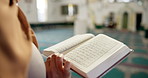 Muslim person, hands and reading with quran at mosque for god worship, knowledge or words of Allah. Closeup of islamic scripture, religious or holy book for information or arabic literature at temple