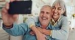 Senior, happy couple and hug with selfie on sofa for picture, bonding or photography at home. Elderly man and woman with smile for memory, moment or embrace in happiness for retirement at house