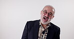 Fashion, laughing and portrait of senior man in studio with glasses, smile or excited on white background. Retired writer, male person or happy with style for joke, funny story on good memories