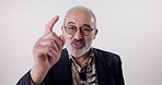 Talking, studio and face of mature man with advice, announcement and news on white background. Communication, discussion and portrait of person with glasses for webinar, seminar and conversation