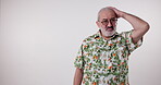 Headache, pain and face of senior man with fatigue, burnout or mockup with health on white background. Stress, migraine and frustrated elderly person with hand on head in retirement with anxiety