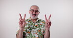 Portrait, senior man and peace sign with fashion in studio on isolated white background. Summer style, colorful and cool in confidence or smile with retro or old school and trendy clothes and shirt