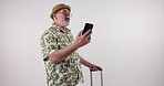 Travel, cellphone and old man with suitcase, vacation and research of hotel, online and reading in studio. White background, mobile and elderly person in retirement, holiday and vision for website