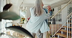 Love, dancing and senior couple holding hands in living room for happiness, relationship or hug. Smile, married man and elderly woman with retirement for movement, care or bonding together in home  