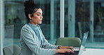 Businesswoman, laptop and typing in office or working on proposal, satisfied or thinking on company pitch. Female accountant, planning and computer for budget strategy, commitment to financial goal