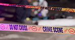 Crime scene, night and ribbon with police tape for murder, investigation or evidence in city. Investigator, team or working late for inspection, observation or mystery case with sign or keep out