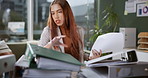 Woman, secretary and folder with search for documents with reading, thinking and frustrated with admin at startup. Person, paperwork and file in modern office, confused or check for report in Mexico