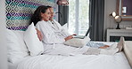 Hotel, relax and senior couple with laptop, check online schedule and getaway trip review in room. People, man and woman in bedroom, computer or research for activity, holiday itinerary or connection