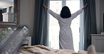 Back, woman and open curtain in bedroom of home for wake up, morning routine and fresh air in robe. Person, new day and drapes of window in hotel for daylight, getting ready and view of accommodation