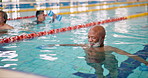 Dumbbell, fitness and mature people in swimming pool for exercise, healthy body and strong muscle. Weight, water and aerobics class for training, physical therapy and rehabilitation in group lesson