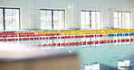 Swimming, indoor and pool with race lines, water for fitness or aquatic training with facility. Empty, inside or design for recreational center, sports equipment or professional with leisure activity