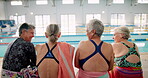 Pool, back and senior people, talking and happy for learning in class of swimming and gym. Workout, healthy and fitness old friends in retirement, cardio and listening to conversation and water