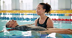 Pool, swimming and senior person, trainer and happy for teaching in rehabilitation centre and woman. Water, relax and learning of old man, patience and physical therapy for aging body and retirement