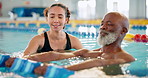 Dumbbell, training and man in swimming pool with instructor for exercise, health and strong muscle. Weight, water and aerobics class for senior fitness, physical therapy and rehabilitation in lesson