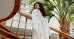 Back view, stairs and woman in villa for holiday, vacation and relax in hotel or island resort. Swimwear or bikini, female person and adventure for destination, hospitality and luxury in morning