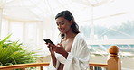 Phone, typing and woman at hotel with communication email for confirm resort booking online for holiday. Hospitality, cellphone and female person browsing for vacation activity on internet for travel