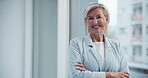 Portrait, arms crossed and happy woman or ceo in office with pride for career and company. Senior professional, leadership or management in workplace and smile for investment or sales in New York