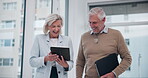 Mature, man and woman with tablet in office for business discussion, compliance report and customer feedback. Corporate, managers and technology for online employee performance and sales targets.