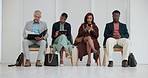 Business people, line and waiting room with technology for career or job opportunity at office. Group of employees, intern or candidates in row on chair for hiring, recruiting or meeting at workplace