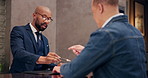 Hotel, employee and guest at reception for check in, hospitality and accommodation with documents. Signing, people and worker with luxury, industry and service with paperwork, concierge and tourism