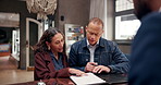 Reception, table and couple with document at hotel for check in, information and customer service. Hospitality, help desk and people with paper in discussion for booking, confirmation and signature