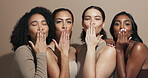 Diversity, women and blow kisses in studio background with smile for natural makeup and glow. Empowerment, portrait and happy or satisfied with skincare cosmetics for beauty with confidence and pride