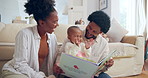 Reading, book and excited baby in home for storytelling or fun and development for motor skills. Parents, fantasy and happy child in living room for weekend and together for support, love and growth
