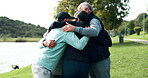 Fitness, group and senior people with hug in park for teamwork, motivation and success in workout. Happy, coach and gesture with applause in nature for exercise support, achievement and collaboration