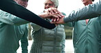 Fitness, senior people hands together with motivation for training, teamwork and workout success. Low angle, friends and collaboration with celebration in nature for exercise, support and achievement