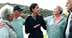 Woman, fitness coach and group of senior people in huddle for advice, guide and motivation for exercise. Scrum, support and outdoor with information for training, workout and wellness in retirement