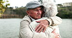 Senior, couple and hug by lake in nature for affection, empathy and support with grief or depression. Elderly, people and embrace outdoor at park with bonding, marriage and connection in retirement