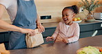 Mother, daughter and packing lunch with bag for morning, healthy snack or meal to school at home. Mom helping happy child, young kid or little girl getting ready for kindergarden with food at house