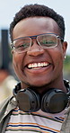 Happy student, black man and face with headphones for ambition, education or learning journey for future at campus. Portrait of young African or male person with smile for scholarship at college