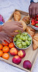 Breakfast, hands and outside picnic with fruits, charcuterie board and food selection with croissants or doughnut. Social gathering, people and health nutrition for diet together, friends and choices