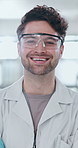 Portrait, scientist and laughing man in lab for research, career and job as biochemist. Confidence, pathology and face of medical doctor in goggles for pharmaceutical study, healthcare and innovation