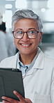 Mature woman, scientist and face with tablet in lab for with application for research, study or trial for chemical. Person, engineer and digital touchscreen for results, review or progress report