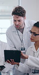 People, medical and engineer with tablet in lab for research, discussion and collaboration of experiment solution. Scientist, teamwork and digital, report results and support for health innovation