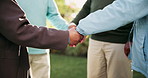 Holding hands, senior people and garden with support, care and love together outdoor with group. Friends, trust and park with solidarity, kindness and empathy in retirement and nature in morning