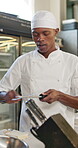 Black man, chef and sharpening knife for cooking, preparation or master class for diet, nutrition or food. Male person, culinary and gourmet cuisine for menu, professional or skill in kitchen as cook