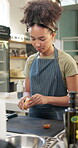 Woman, onion and cooking class in kitchen, industry or hospitality for diet, nutrition or food. Female person, culinary and gourmet cuisine for menu, professional or skill in preparation in school