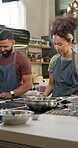 Couple, students and cooking class in kitchen, industry or hospitality for diet, nutrition or food. Woman, man and culinary arts for gourmet cuisine, menu and creativity for skills as cook in school