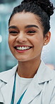 Woman, doctor and laugh with portrait for healthcare, closeup and clinic in hospital. Medicine, professional and surgeon for female person, medical and face for pride and help service for patient