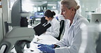 Computer, microscope and science with person in laboratory for development, innovation or pharmaceuticals. Healthcare, medical and research with scientist typing pharmaceutical report for discovery