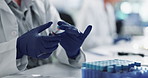 Hands, gloves and blood sample in lab with label for test, assessment or clinical analysis at pharma company. Scientist, person and glass container with dna, results and ppe with vaccine development