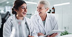 Team, scientist and happy women with tablet for research, innovation and chemistry with lab assistant. Medical, science and collaboration on computer for exam, biotechnology and laughing with mentor