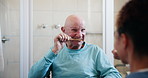 Brushing teeth, cleaning and senior man with grooming learning from caregiver with dementia help. Medical, dental and oral hygiene support with nurse in bathroom for wellness teaching in retirement