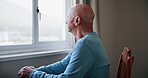 Lonely, senior man and depression with thinking of memory, mental health or nostalgia with dementia in retirement. Elderly, person and alzheimer with grief, cane or remember by window in nursing home