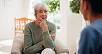 Elderly, woman and caregiver with conversation at house for medical consultation, healthcare and information. Senior, patient and nurse for communication of concerns, diagnosis results and feedback