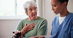 Caregiver, senior woman and coughing with tablet at nursing home for health check, update and report. People, nurse and pensioner conversation in bedroom at retirement house for support and care 