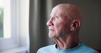 Sad, elderly man and depression with thinking of memory, mental health and nostalgia with dementia in retirement. Senior, person and alzheimer with grief, lonely or remember by window in nursing home